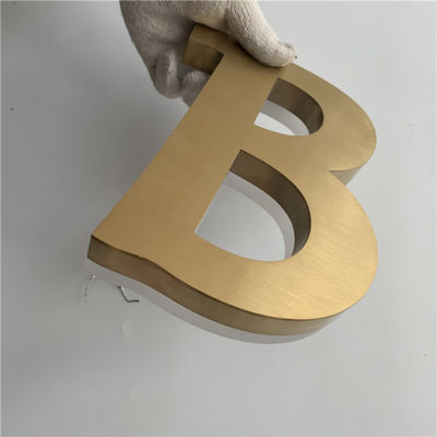 Goldbürsten-Edelstahl-hintergrundbeleuchtete Zeichen asphaltieren Buchstaben